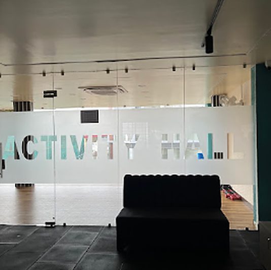 Frosted glass wall reading Activity Hall