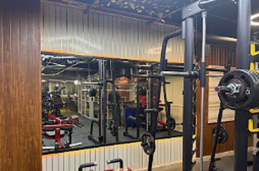 Squat rack area with wooden slat wall